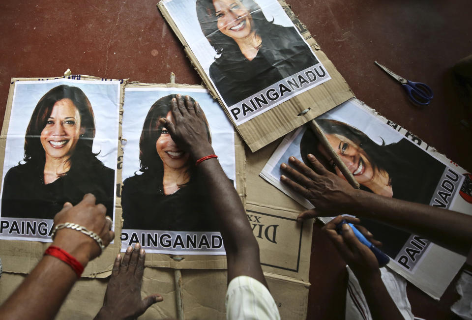 FILE - In this Nov. 6, 2020, file photo, villagers prepare placards featuring U.S. democratic vice presidential candidate Sen. Kamala Harris, as they prepare to celebrate should the Democratic Party win the presidential elections, in Painganadu a neighboring village of Thulasendrapuram, south of Chennai, Tamil Nadu state, India. Harris made history Saturday, Nov. 7, as the first Black woman elected as vice president of the United States, shattering barriers that have kept men — almost all of them white — entrenched at the highest levels of American politics for more than two centuries. (AP Photo/Aijaz Rahi, File)
