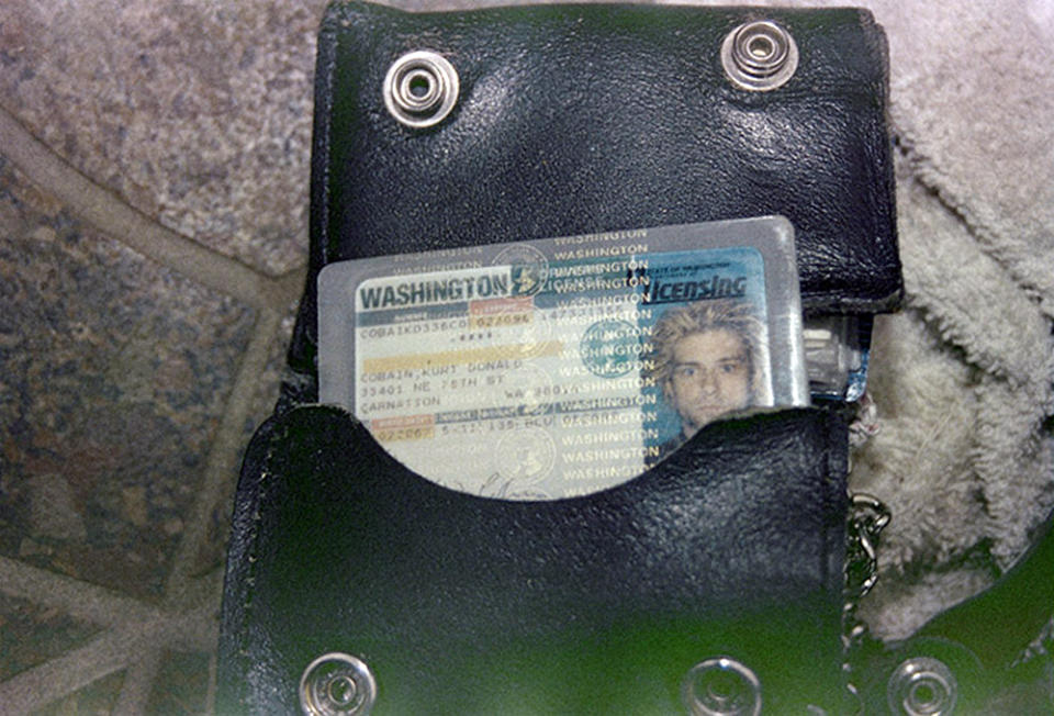 FILE - This April 1994 photo from the Seattle Police Department shows a wallet containing Kurt Cobain's Washington state driver's license, found at the scene of his suicide, in Seattle. A handwritten note police discovered in Kurt Cobain's wallet after his suicide disparages his wife Courtney Love. CBS News reports Wednesday, April 30, 2014, that the note was taken from Cobain's wallet when police arrived at his home on April 8, 1994, after Cobain fatally shot himself. The note was never made public. CBS obtained it from the Seattle Police via a public information request. The network reports that the undated note, apparently written by Cobain on stationery from San Francisco's Phoenix Hotel, is written like a mock wedding vow. It references Love as Cobain's "lawful shredded wife" who would be "siphoning" his money for drugs. (AP Photo/Seattle Police Department)