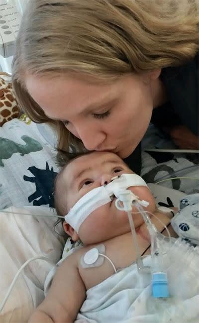 Mrs Dolan kisses her son before surgery. Photo: Facebook/HopeforHenry