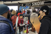 LJ Henriquez, center, waits for the grand opening of Big Snow in East Rutherford, N.J., Thursday, Dec. 5, 2019. The facility, which is part of the American Dream mega-mall, is North America's first indoor ski and snowboard slope with real snow. (AP Photo/Seth Wenig)