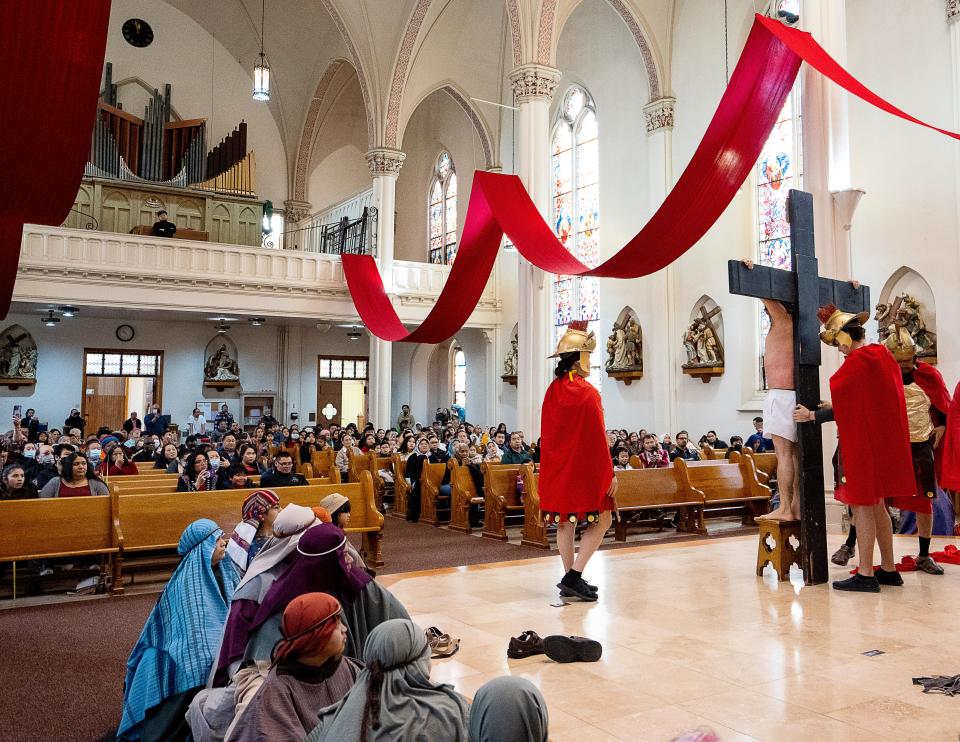 Parish members recreate Jesus' crucifixion for Palm Sunday Mass at St. Michael's Catholic Church in Milwaukee.