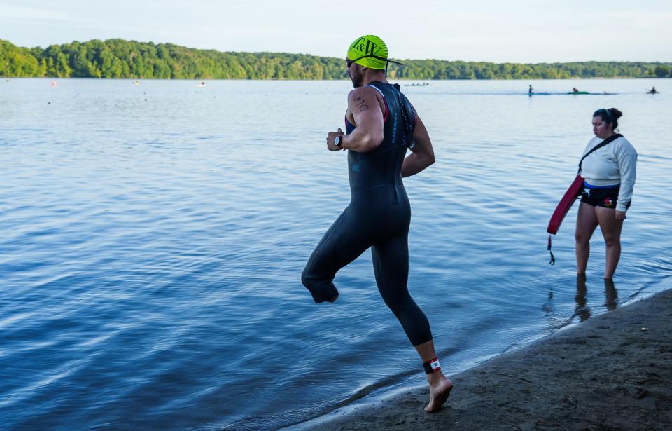 Uriah Steffen takes off Saturday, Aug. 13, 2022, for the swim portion of an Indianapolis Sprint Triathlon Series event at Eagle Creek Park in Indianapolis. Steffen says it was 18 months after the accident when he was able to receive a prosthetic. At the six-month mark of his recovery, he says things got dark. "I had entered into a depression that I didn't know how to get out of," he said. "I was ready to end it and let my wife go. She can go and create a new life with somebody else who's not a mangled mess like I am, who's not this mentally depressed individual who just doesn't know what independence looks like, who has so many issues of looking in the mirror and can't decide what he looks like and who he is." Steffen's goal is to compete in the 2024 Paralympics in Paris.