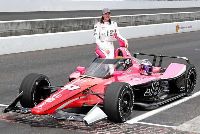 <p>Brian Spurlock/Icon Sportswire via Getty</p> Katherine Legge poses with her race car