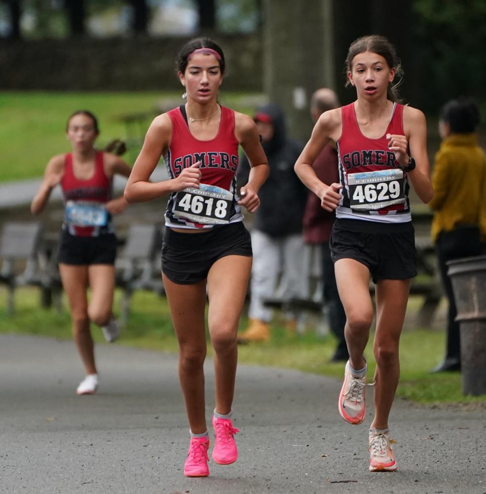 Julia Aquilino (4618) and Julia Duzynski (4629_ of Somers compete in the Suffern Invitational at Bear Mountain State Park in Tomkins Cove September 23, 2023. The pair helped the Tuskers capture the overall girls team title out of 17 squads.