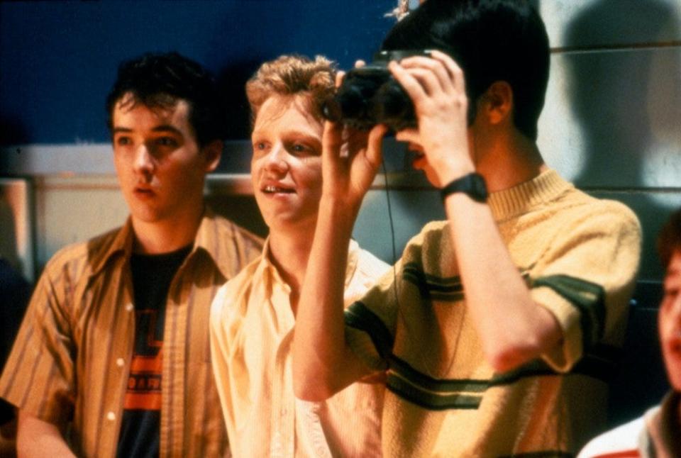 John Cusack, Anthony Michael Hall, and Darren Harris at a high school dance