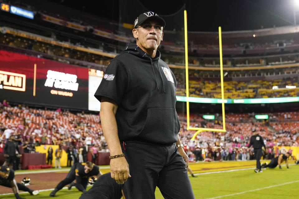 Washington Commanders head coach Ron Rivera on the field before the start of an NFL football game against the Chicago Bears, Thursday, Oct. 5, 2023, in Landover, Md. (AP Photo/Andrew Harnik)