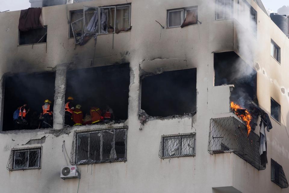  An apartment caught fire by an Israeli airstrike in Gaza City (AP)