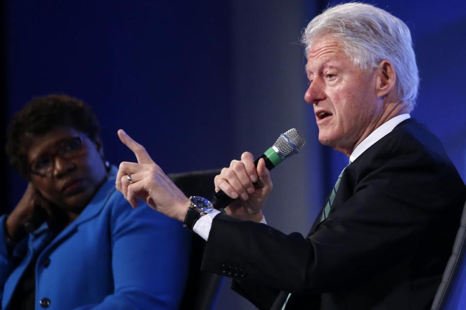 Former President Bill Clinton answers questions from Gwen Ifill of PBS NewsHour at the 2014 Fiscal Summit organized by the Peter G. Peterson Foundation in Washington, Wednesday, May 14, 2014. Lawmakers and policy experts discussed America's long term debt and economic future. (AP Photo)