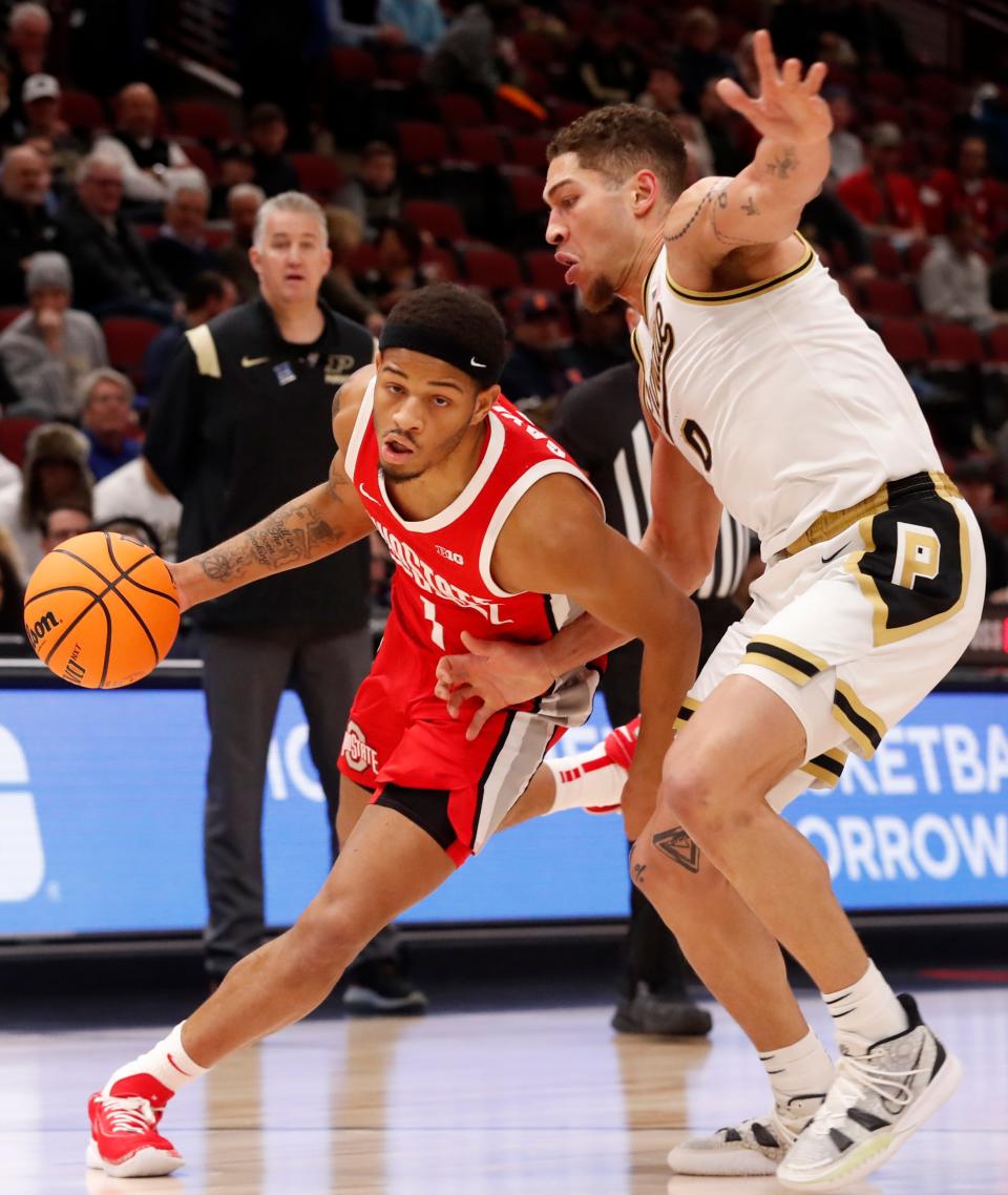 Ohio State Buckeyes guard Roddy Gayle Jr. (1) drives past Purdue Boilermakers forward Mason Gillis (0) during the Big Ten Men’s Basketball Tournament semifinal game, Saturday, March 11, 2023, at United Center in Chicago. 