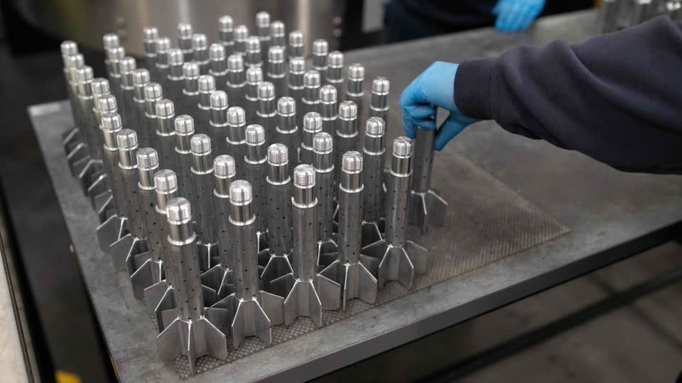 A BAE Systems employee works on High Explosive Mortar munitions at the company's factory near Newcastle upon Tyne, England, in November 2023. - Oli Scarff/AFP/Getty Images