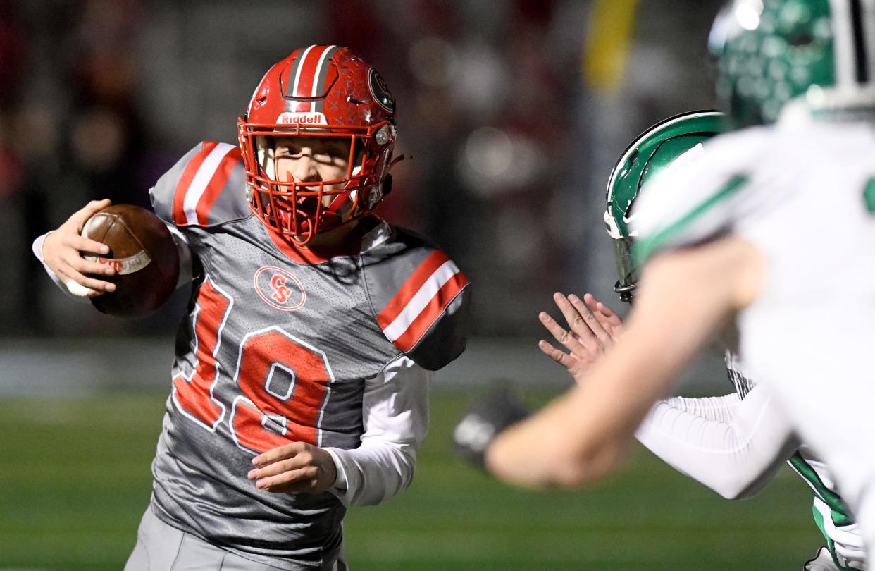 Canton South quarterback Poochie Snyder runs the ball in the first quarter of a Division IV regional semifinal against West Branch at Louisville Leopard Stadium. Friday, Nov. 10, 2023.