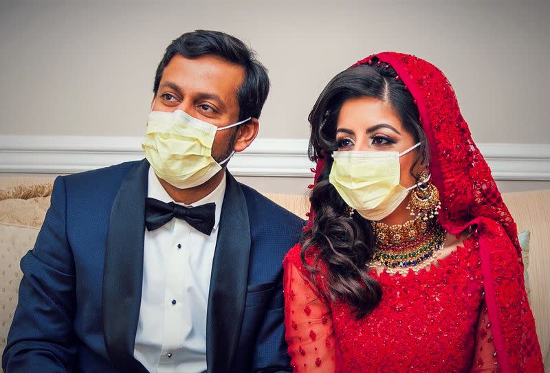 ldDoctors Kashif Chaudhry and Naila Shereen wear face masks after their wedding in New Windsor