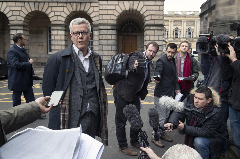 Lawyer Jolyon Maugham speaks to the media outside court in Edinburgh, as judges are asked to consider whether a court can sign a Brexit extension request letter on behalf of the government, Tuesday Oct. 8, 2019. Britain and the European Union have said a Brexit deal might be impossible, with just over three weeks until its scheduled departure from the bloc, unless a deadline extension is granted. (Jane Barlow/PA via AP)