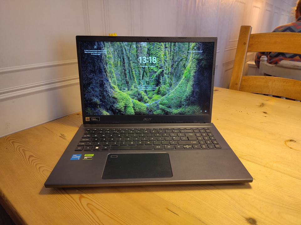 An Acer Aspire 7 sitting on a wooden desk