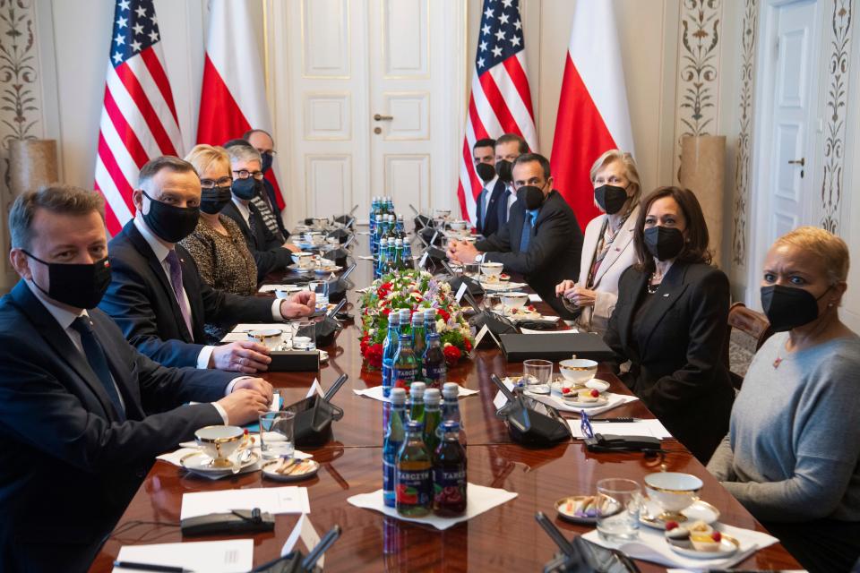 Polish President Andrzej Duda, second left, sits opposite US Vice President Kamala Harris, during a meeting at Belwelder Palace, in Warsaw, Poland, Thursday, March 10, 2022. (Saul Loeb/Pool Photo via AP)