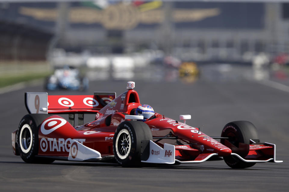 Scott Dixon, of New Zealand, drives through the turn 7 during practice for the inaugural Grand Prix of Indianapolis IndyCar auto race at the Indianapolis Motor Speedway in Indianapolis, Thursday, May 8, 2014. (AP Photo/Michael Conroy)