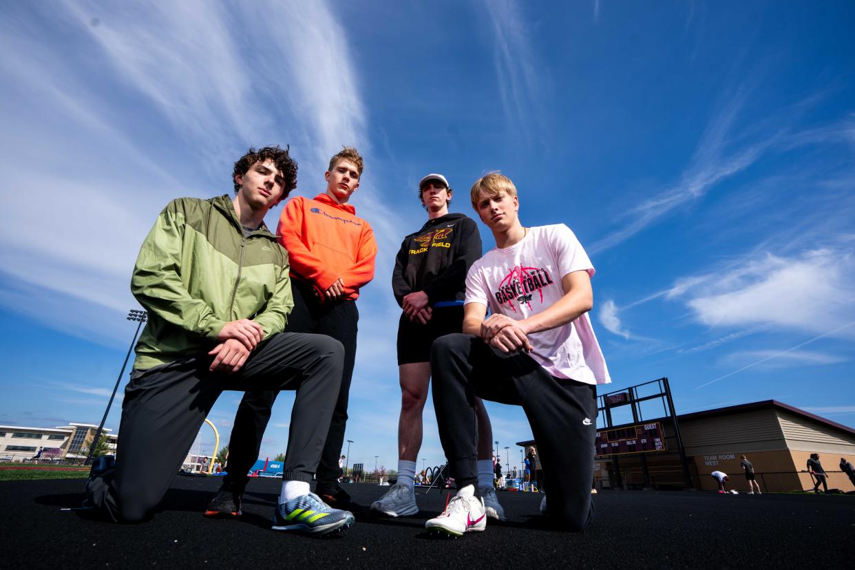 Ankeny's Jackson Belding, Logan Fairchild, Tyler Sickerson and Devon Akers pose for a photo during practice on April 17 at Ankeny High School.