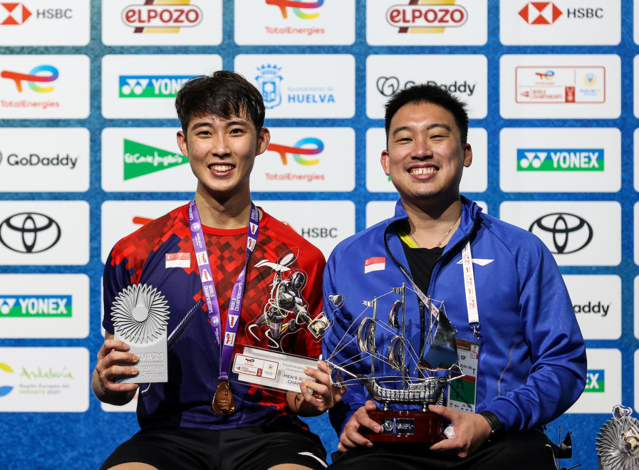 New national singles head coach Kelvin Ho (right) with Loh Kean Yew when he won the Badminton World Championships in December 2021. (PHOTO: Singapore Badminton Association)