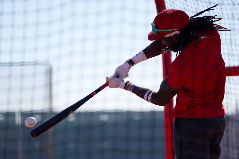 Cincinnati Reds shortstop Elly De La Cruz (44) connects on a pitch during spring training workouts, Wednesday, Feb. 14, 2024, at the team’s spring training facility in Goodyear, Ariz.