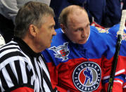 Russian President Vladimir Putin (R) talks to International Ice Hockey Federation (IIHF) President Rene Fase during a gala game of the Night Ice Hockey League in Sochi, Russia, May 10, 2016. Mikhail Klimentyev/Sputnik/Kremlin via Reuters