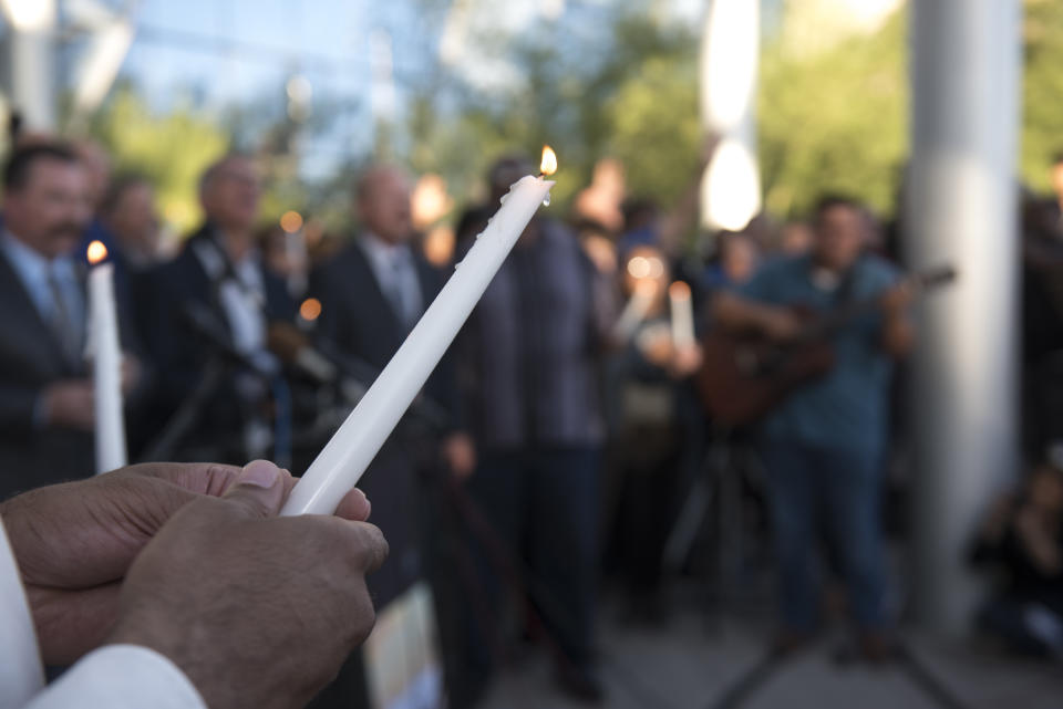 Candles are lit during a vigil held at Las Vegas City Hall.&nbsp;