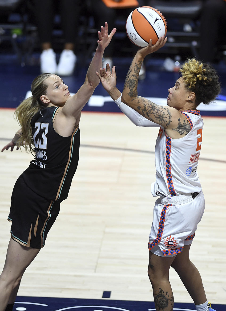 Connecticut Sun's Natisha Hiedeman (2) shoots against New York Liberty's Marine Johannès (23) during the first half of a WNBA basketball game Tuesday, June 27, 2023, in Uncasville, Conn. (Sarah Gordon/The Day via AP)