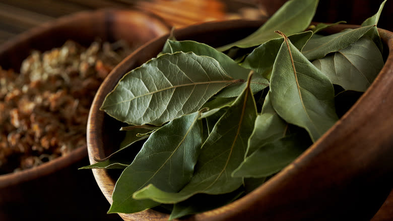 bay leaves in wooden container