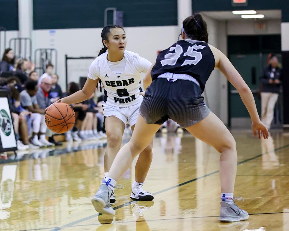 Cedar Park point guard Molly Ly surveys the Georgetown defense in the district finale Tuesday at Cedar Park High School. Cedar Park's offense came alive in the second half en route to a 50-24 victory.