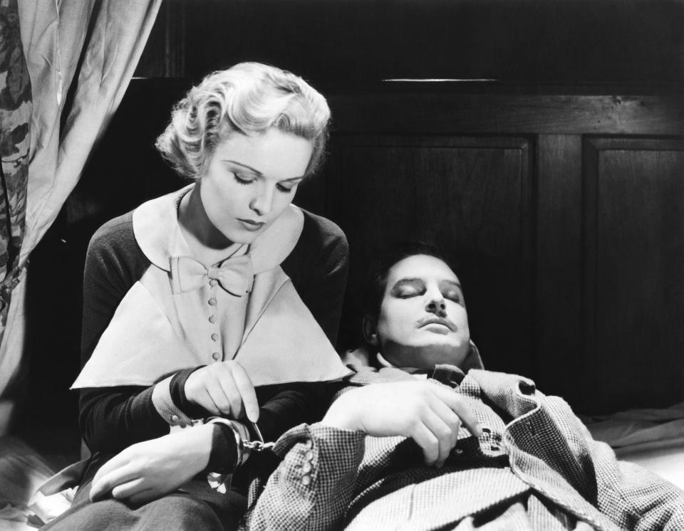 Madeleine Carroll and Robert Donat on the set of "The 39 Steps", directed by Alfred Hitchcock. (Photo by Sunset Boulevard/Corbis via Getty Images)