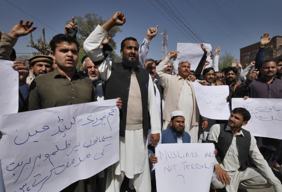 Pakistani traders shout slogans during a demonstration to condemn the Christchurch mosques shooting, in Peshawar, Pakistan, Sunday, March 17, 2019. Pakistan's foreign ministry spokesman says three more Pakistanis have been identified among the dead increasing the number of Pakistanis to nine killed in the mass shootings at two mosques in the New Zealand city of Christchurch. (AP Photo/Mohammad Sajjad)