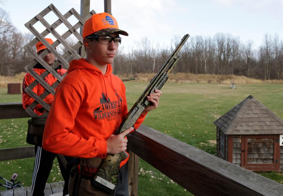 Natron Daggett, 16, waits for instructions from life science teacher Natalie Weeks during a session on skeet shooting at the Highlands Sportsmen's Club, Wednesday, November 9, 2022, in Cascade, Wis.