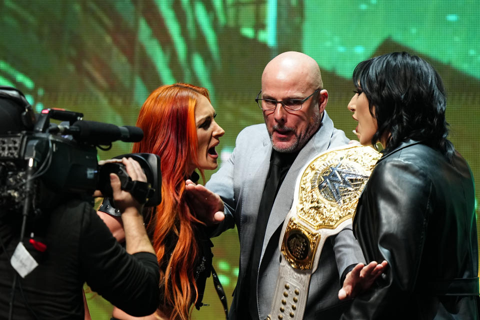 LAS VEGAS, NV - FEBRUARY 08:  Becky Lynch meets Rhea Ripley face-off on stage during the WWE Wrestlemania XL Kickoff on February 08, 2024, at T-Mobile Arena in Las Vegas, NV. (Photo by Louis Grasse/PXimages/Icon Sportswire via Getty Images)