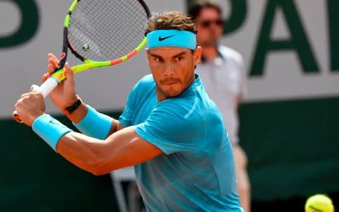 Spain's Rafael Nadal returns the ball to Argentina's Guido Pella during their men's singles second round match on day five of The Roland Garros 2018 French Open tennis tournament in Paris on May 31, 2018 - Credit: AFP