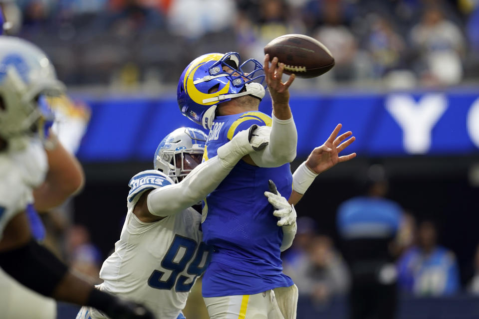 Los Angeles Rams quarterback Matthew Stafford is hit by Detroit Lions linebacker Julian Okwara during the second half of an NFL football game Sunday, Oct. 24, 2021, in Inglewood, Calif. (AP Photo/Marcio Jose Sanchez)