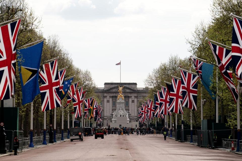 Union flags hang outside Buckingham Palace on The Mall ahead of Saturday’s coronation (Jordan Pettitt/PA)