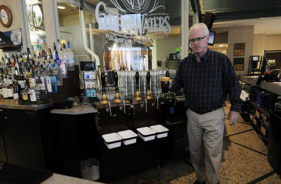 Great Waters Brewing Co., owner Sean O'Byrne poses for a photograph, Wednesday, Oct. 24, 2012, in St. Paul, Minn. at his brewpub located near the Xcel Center, home of the Minnesota Wild NHL hockey team. O'Byrne's business is down 20 percent since the start of the NHL lockout and thatks a painful reminder of the 2004-05 lockout that wiped out the entire NHL season. (AP Photo/Jim Mone)