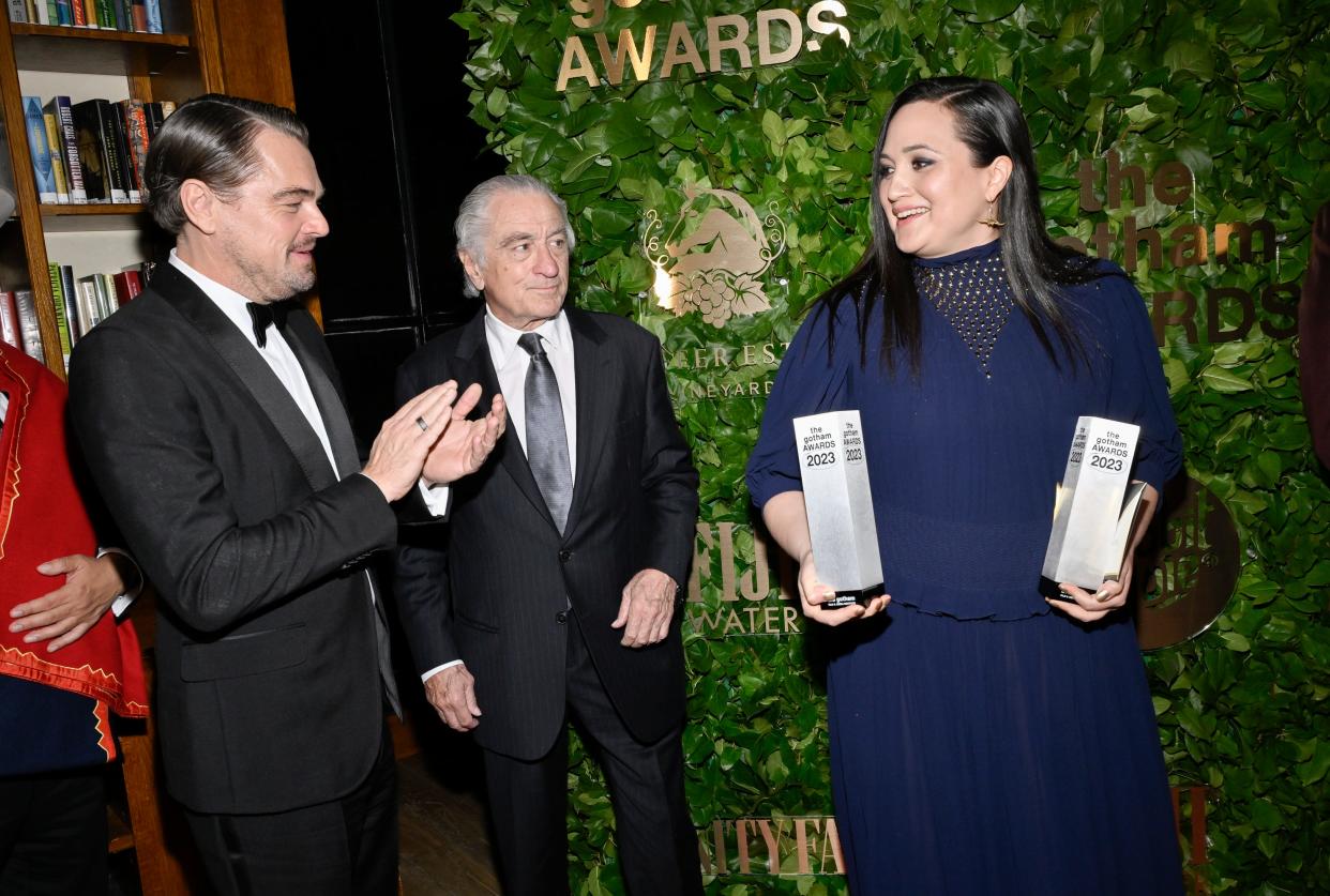 Leonardo DiCaprio, left, Robert De Niro and Lily Gladstone pose on Nov. 27 with the Gotham Historical Icon & Creator Tribute for "Killers of the Flower Moon," at the Gotham Independent Film Awards at Cipriani Wall Street in New York.