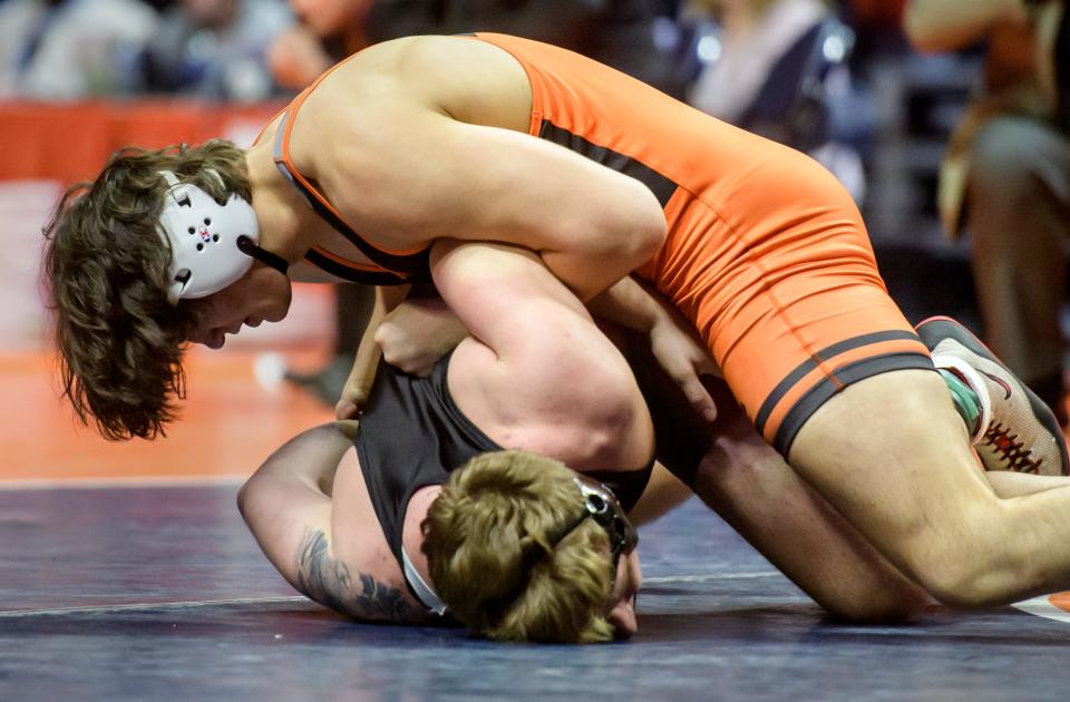 Washington's Justin Hoffer, top, holds LaSalle-Peru's Connor Lorden in the 220-pound title match of the  Class 2A state wrestling tournament Saturday, Feb. 18, 2023 at State Farm Arena in Champaign. Hoffer took the title with a 5-2 decision.