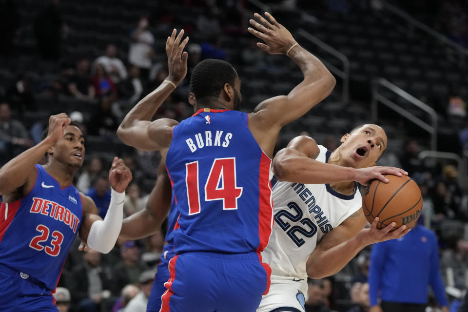 Memphis Grizzlies guard Desmond Bane (22) looks to shoot as Detroit Pistons guard Alec Burks (14) defends during the first half of an NBA basketball game, Wednesday, Dec. 6, 2023, in Detroit. (AP Photo/Carlos Osorio)