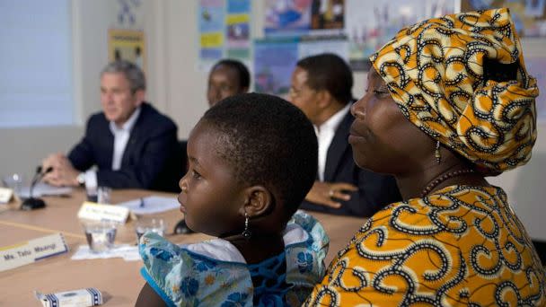 PHOTO: FILE - Tatu Msangi holds her three-year-old daughter Faith during a roundtable discussion with US President George W. Bush on the PEPFAR AIDS program at the Amana district hospital, Feb. 17, 2008 in Dar es Salaam. (Mandel Ngan/AFP via Getty Images, FILE)