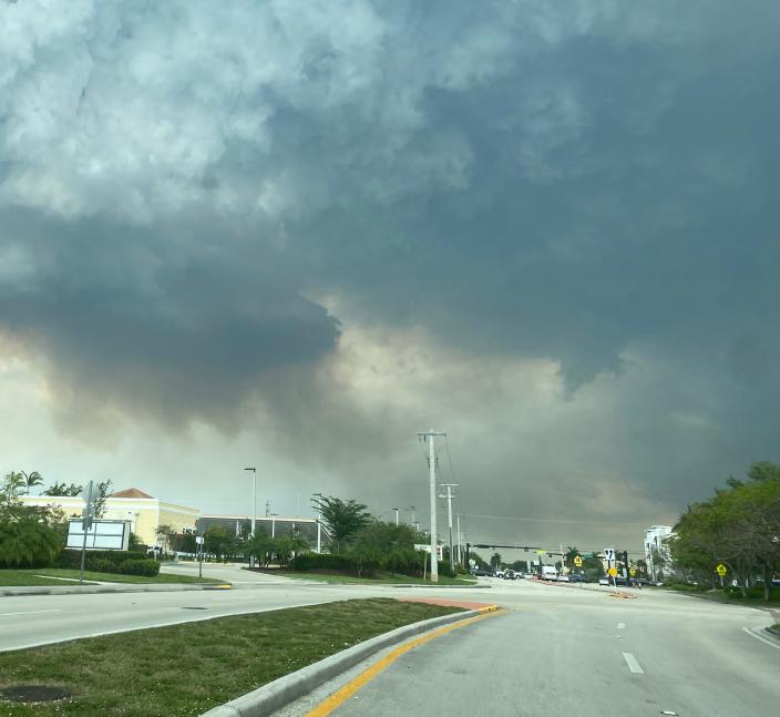 Smoke and soot can be seen from roads in western Broward County that are the result of three wildfires burning.