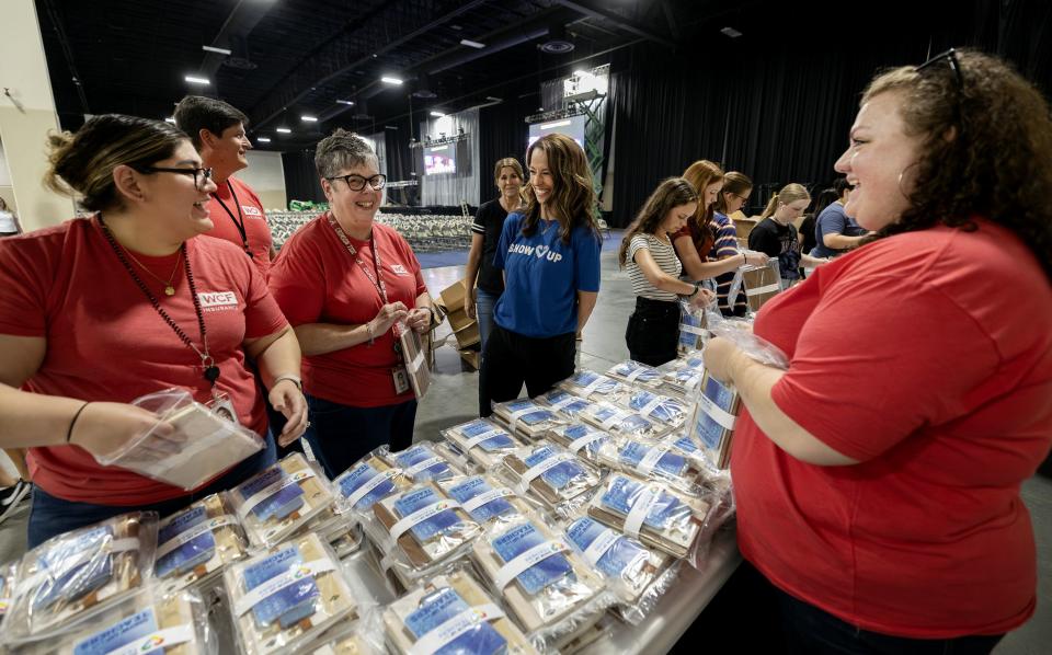 Utah first lady Abby Cox talks with a group of volunteers as they work with her team to get ready for the Show Up for Teachers event at the Mountain America Exhibition Center in Sandy on Tuesday, July 18, 2023. | Scott G Winterton, Deseret News
