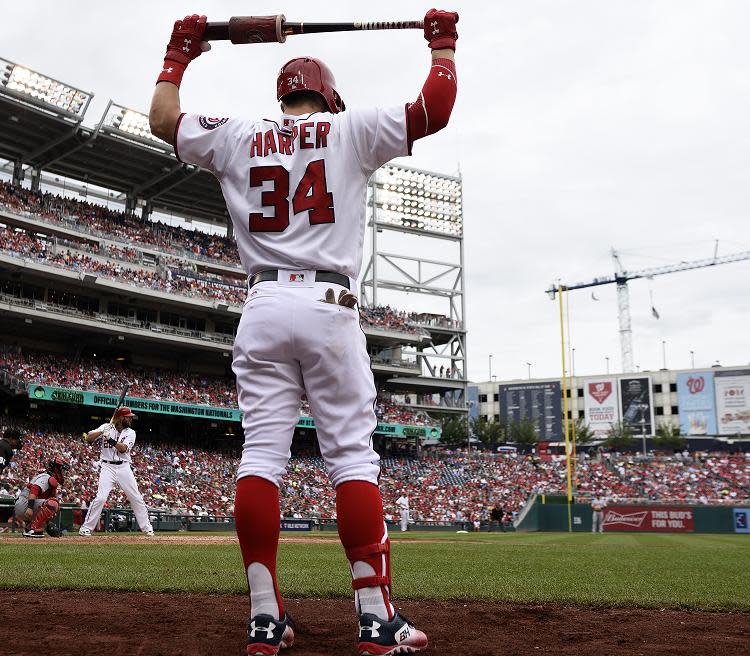 Bryce Harper warms up on deck with his regular bat. (AP)