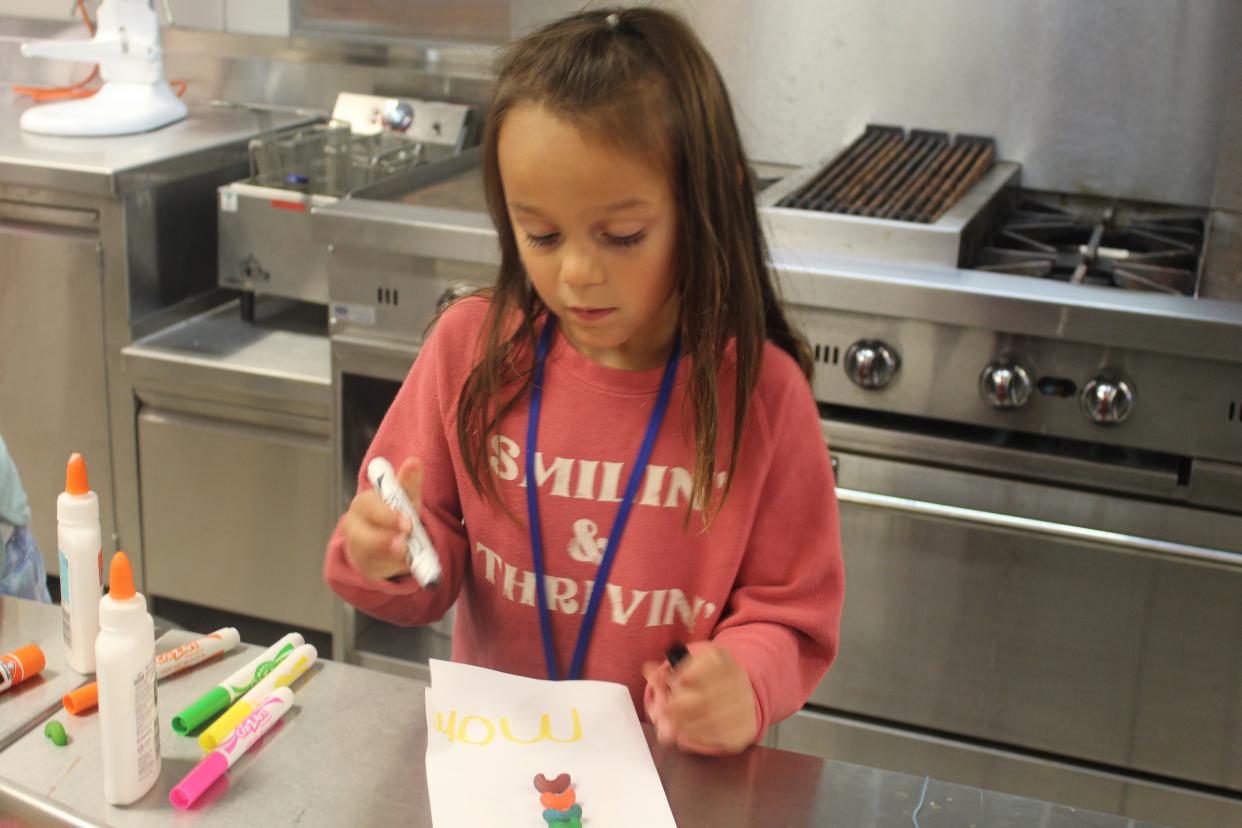 Olivia Vela, 6, works on an art project in Terra State Community's KidsCollege's Food Art class Wednesday at the college. KidsCollege at Terra State Community College has been a source of academic enrichment for more than 4,700 students in 1st through 8th grade.