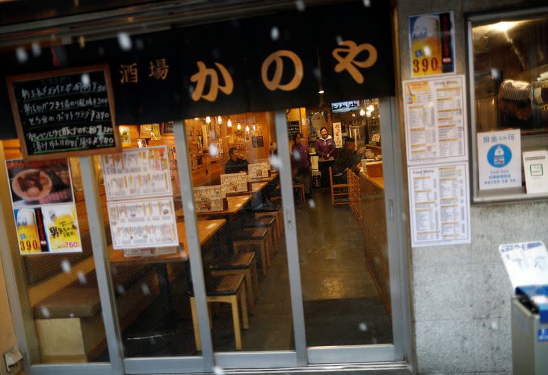 Empty seats are seen inside a restaurant in a snow fall during a coronavirus disease outbreak in Tokyo