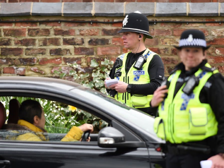 <p>Police officers from North Yorkshire Police stop motorists in cars to check that their travel is “essential”, in line with the British Government’s Covid-19 advice to “Stay at Home”, in York, back in March 2020</p> (AFP/Getty)