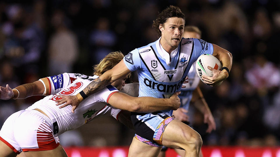 Seen here, Sharks star Nicho Hynes running the footy against the Dragons in round 18 of the NRL. 
