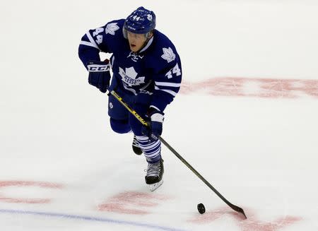 Oct 8, 2014; Toronto, Ontario, CAN; Toronto Maple Leafs defenseman Morgan Rielly (44) carries the puck against the Montreal Canadiens at the Air Canada Centre. Montreal defeated Toronto 4-3. John E. Sokolowski-USA TODAY Sports