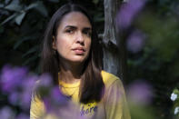 Juliana Macedo do Nascimento, 36, a Deferred Action for Childhood Arrivals program recipient who moved to the U.S. from Brazil when she was 14, poses for a portrait, Friday, Sept. 2, 2022, outside her apartment in Washington. Immigrants who signed up for an Obama-era program shielding them from deportation, long a symbol of youth, are increasingly easing into middle age. (AP Photo/Jacquelyn Martin)