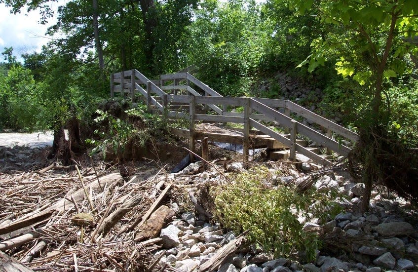 River debris and damage at the Lock 29 Trailhead in Peninsula after a July 2003 flood.